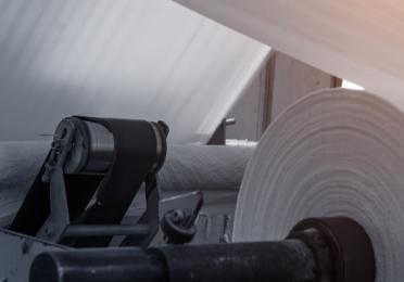 large paper roll in a paper manufacturing plant